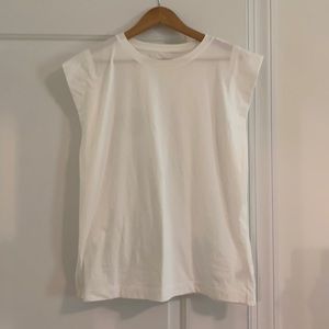 white muscle tank with elevated sleeves